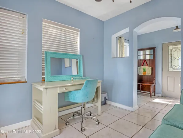 a workspace with furniture and window