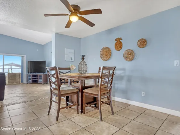 a dining room with furniture and a window