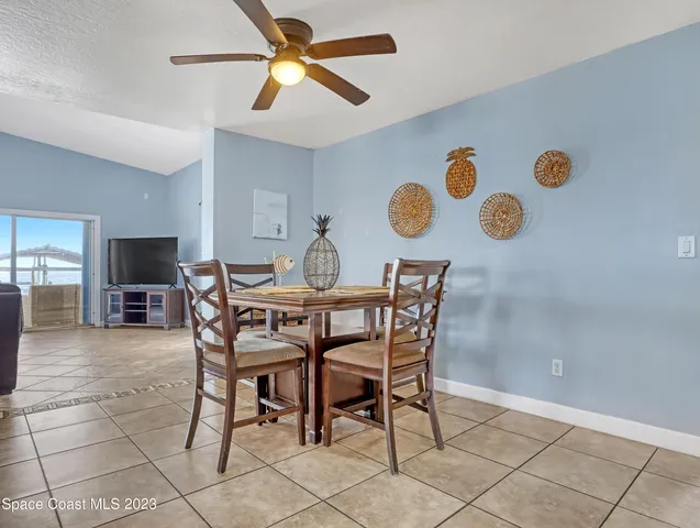 a dining room with furniture and a window