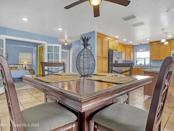 a view of a swimming pool kitchen from a dining room