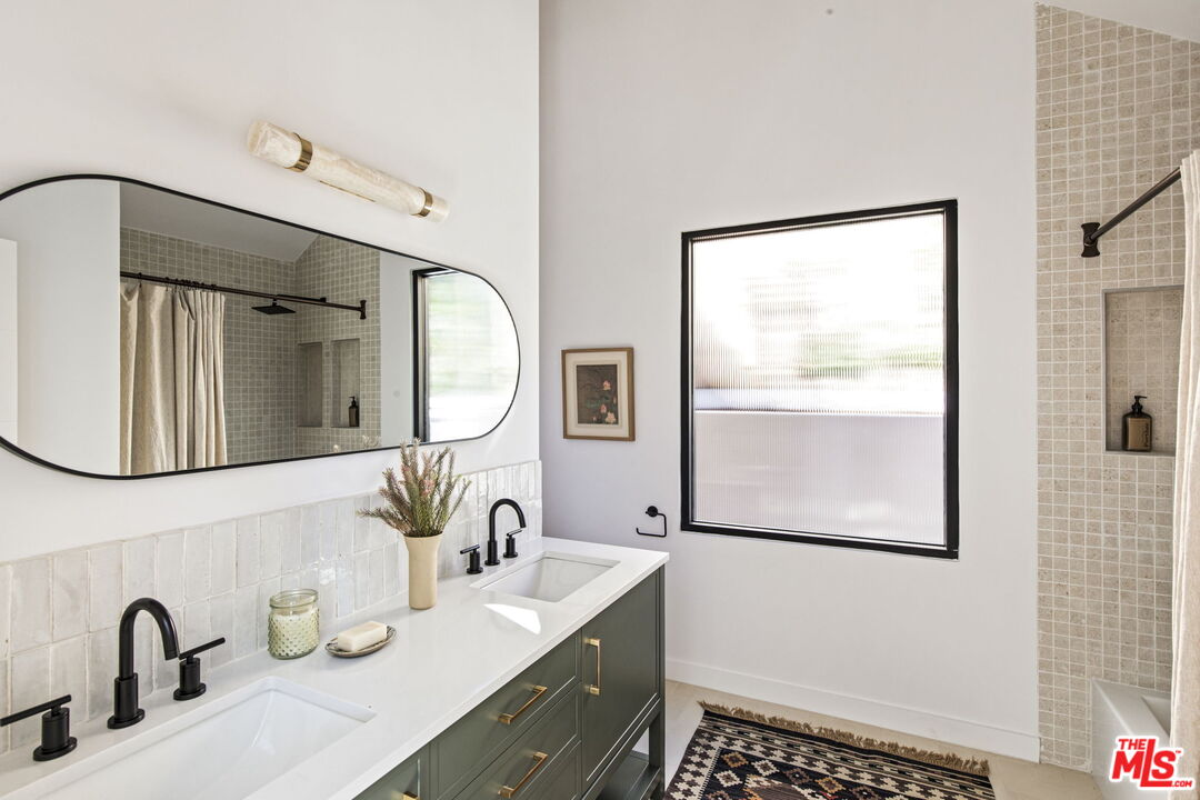 8550 Ridpath Drive Los Angeles, CA 90046 - Photo 16 of 32 a bathroom with a double vanity sink mirror and