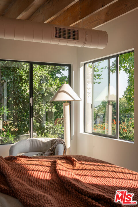 8550 Ridpath Drive Los Angeles, CA 90046 - Photo 20 of 32 a living room with a bed and a table