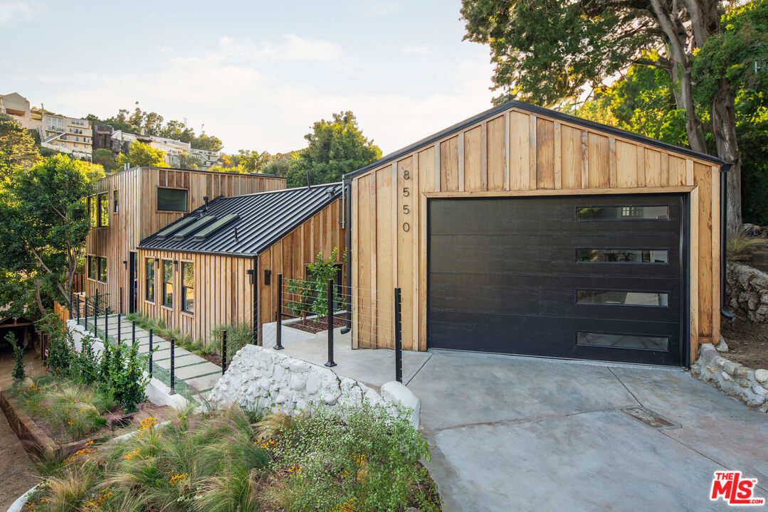 8550 Ridpath Drive Los Angeles, CA 90046 - Photo 2 of 32 a house view with a outdoor space