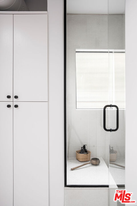 8550 Ridpath Drive Los Angeles, CA 90046 - Photo 22 of 32 a bathroom with a sink and mirror