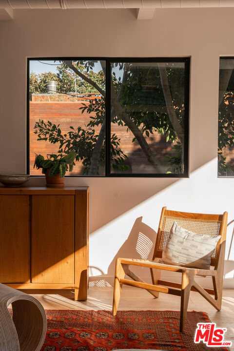 8550 Ridpath Drive Los Angeles, CA 90046 - Photo 5 of 32 a view of a living room with a floor to ceiling window and wooden floor