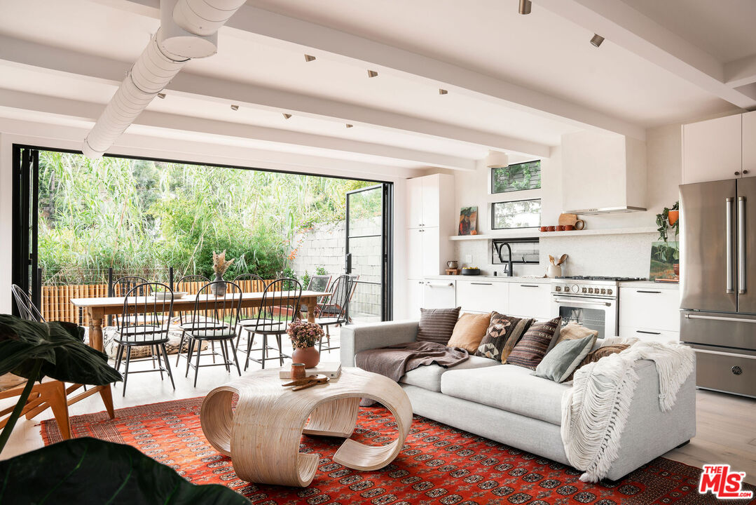8550 Ridpath Drive Los Angeles, CA 90046 - Photo 8 of 32 a living room with furniture and a large window