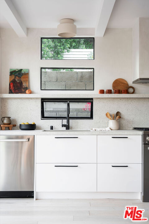 8550 Ridpath Drive Los Angeles, CA 90046 - Photo 10 of 32 a kitchen with a stove and a white cabinet