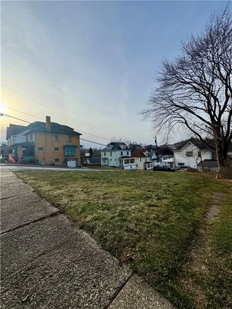 a view of a town with large trees