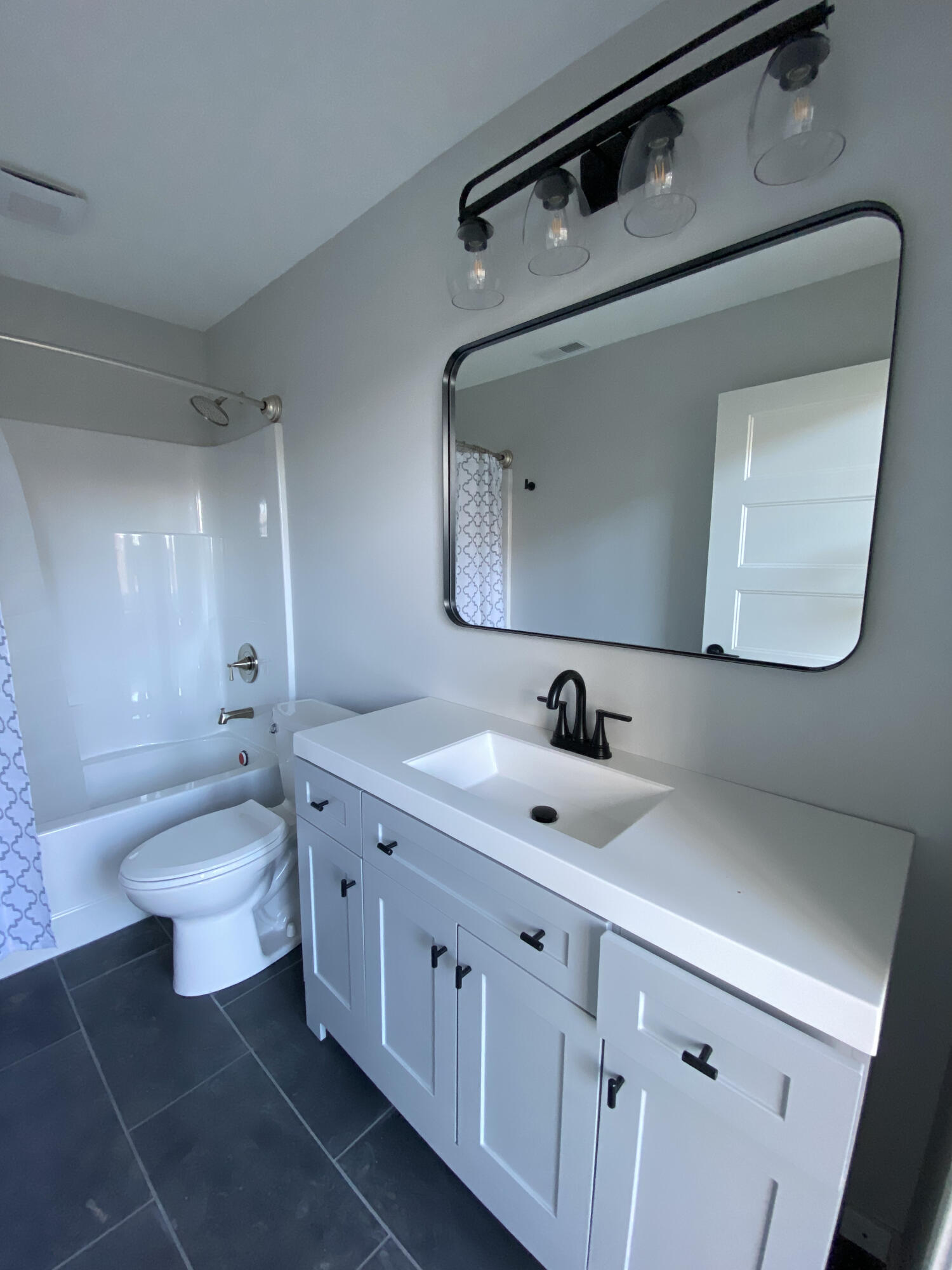 100 Marshall Way, Unit 101 Fieldale, VA 24089 - Photo 5 of 19 a bathroom with a double vanity sink mirror and toilet