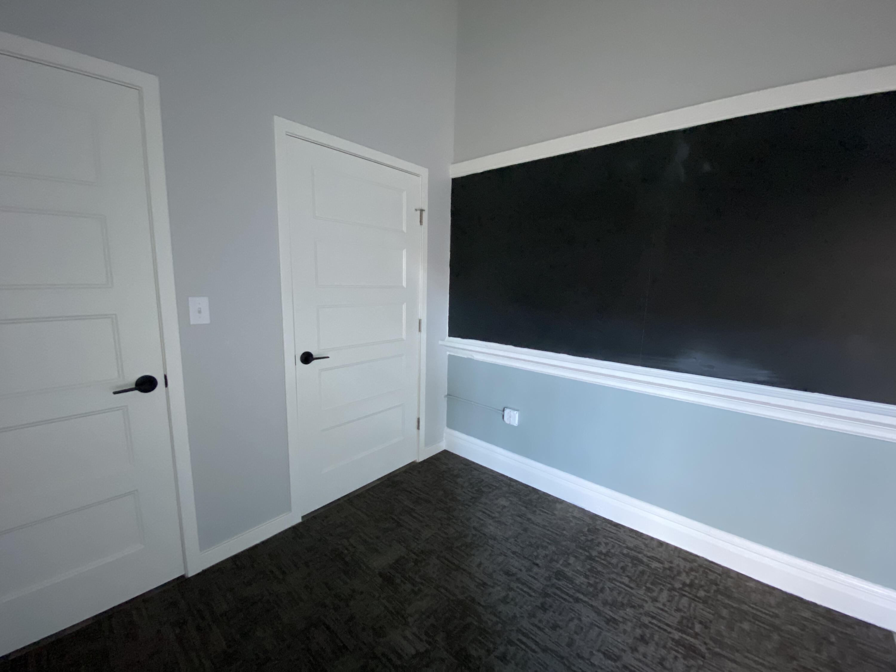 100 Marshall Way, Unit 101 Fieldale, VA 24089 - Photo 7 of 19 a view of an empty room with wooden floor and a window