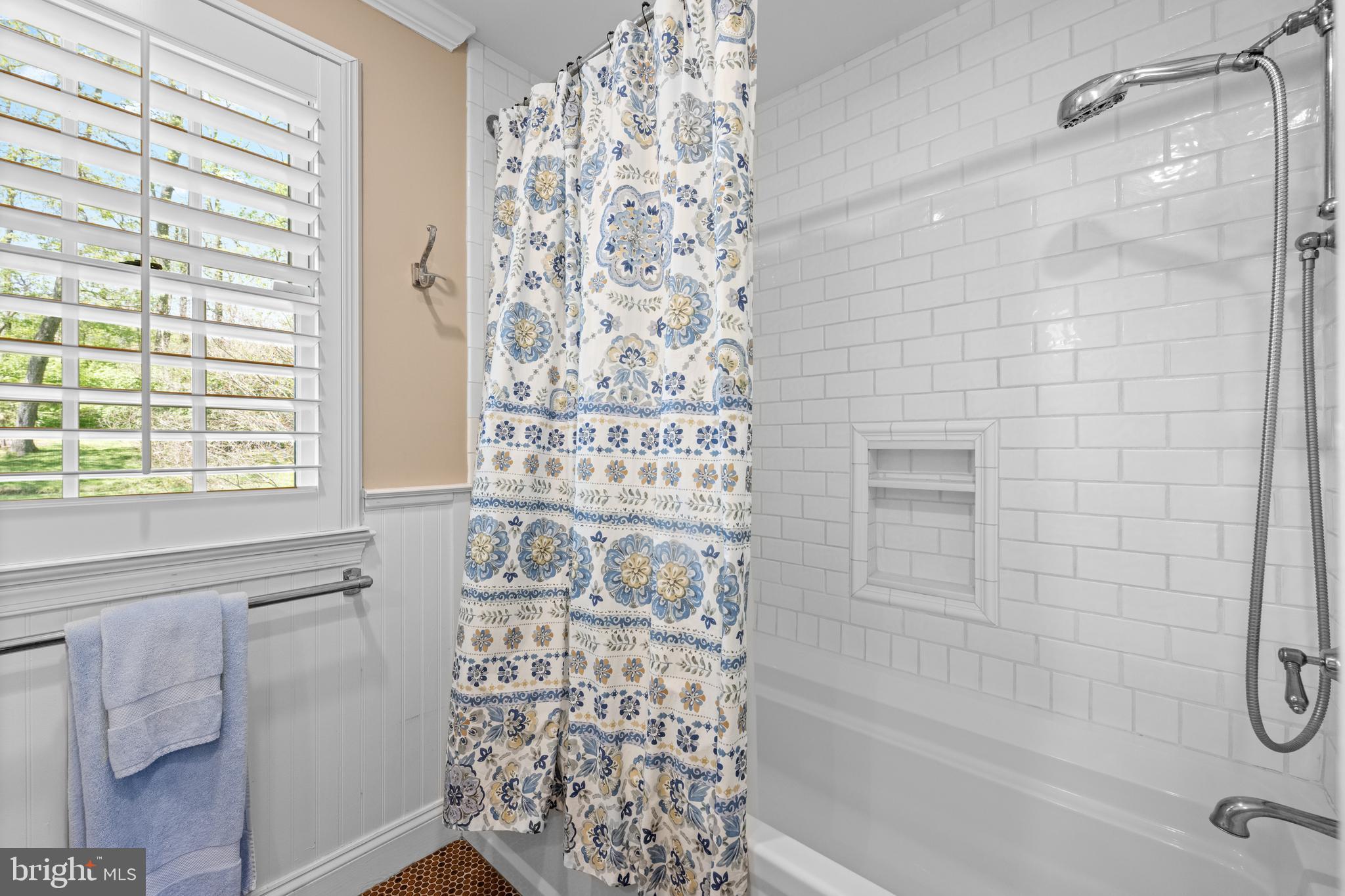 1064 Beaumont Road Berwyn, PA 19312 - Photo 29 of 41 Tub with Shower Head and Crisp Tile Surround