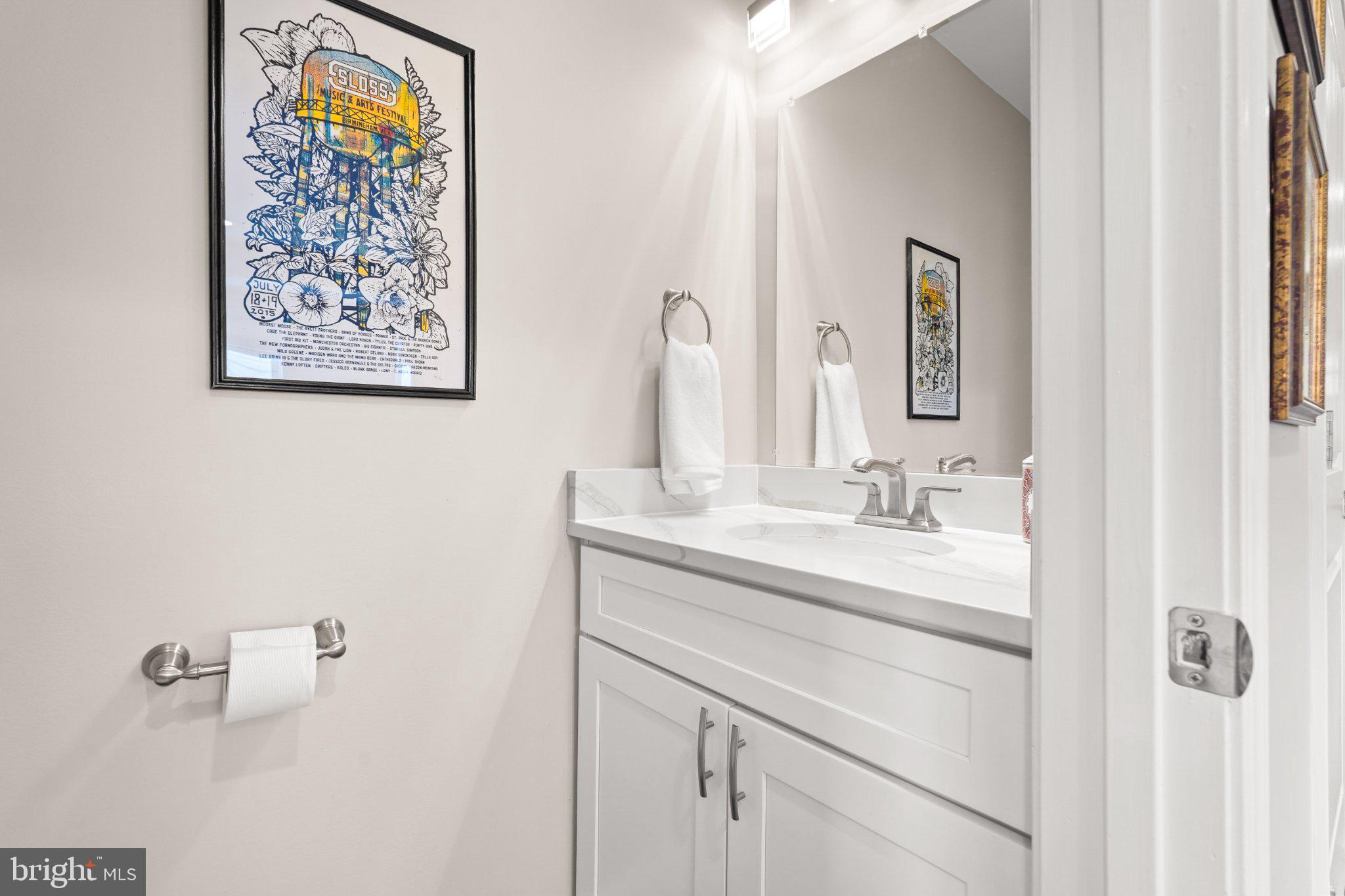 4416 Gault Place Northeast Washington, DC 20019 - Photo 13 of 30 a bathroom with a sink and a mirror