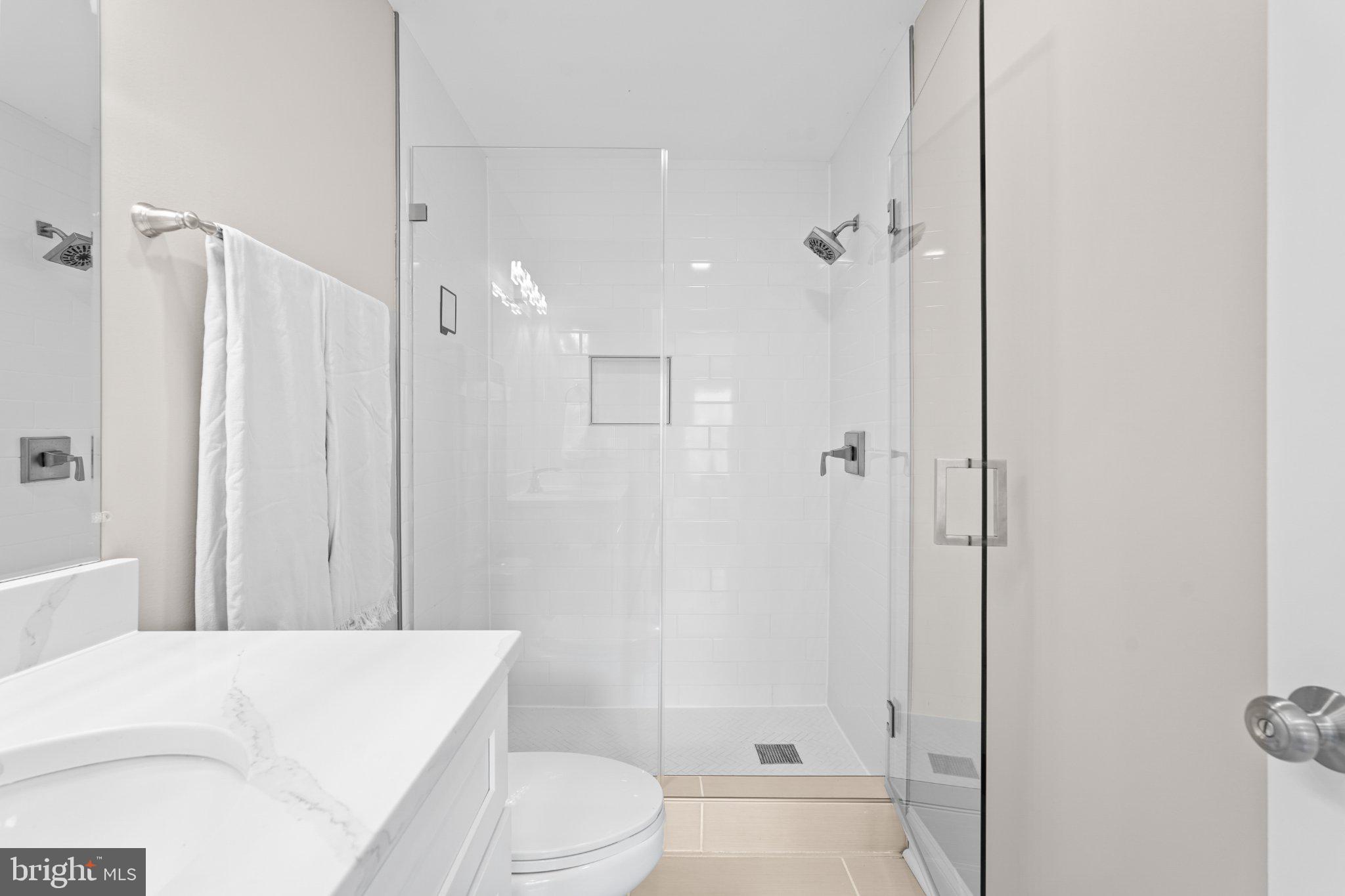 4416 Gault Place Northeast Washington, DC 20019 - Photo 20 of 30 a bathroom with a sink a toilet and shower
