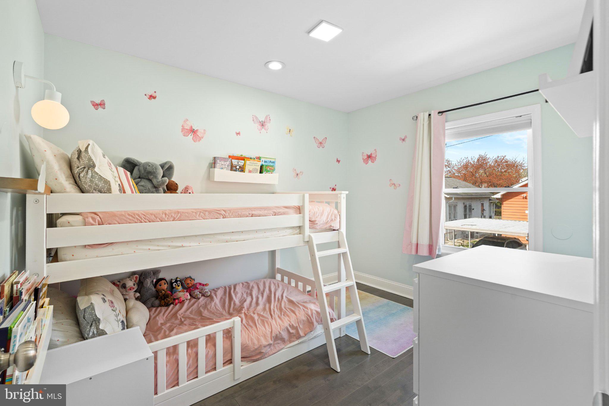 4416 Gault Place Northeast Washington, DC 20019 - Photo 21 of 30 a bedroom with a bed and a large window