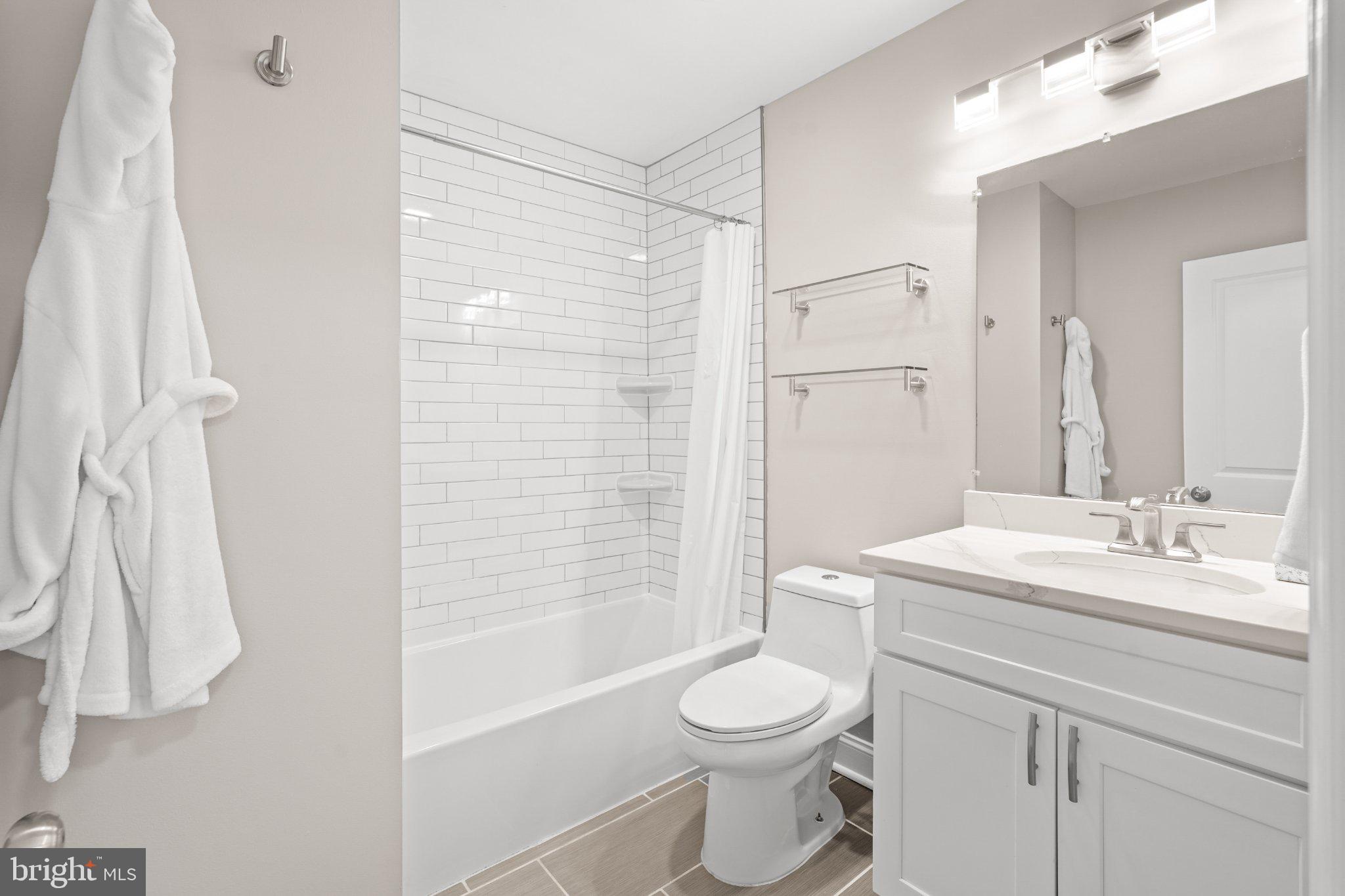 4416 Gault Place Northeast Washington, DC 20019 - Photo 25 of 30 a bathroom with a sink a toilet and shower