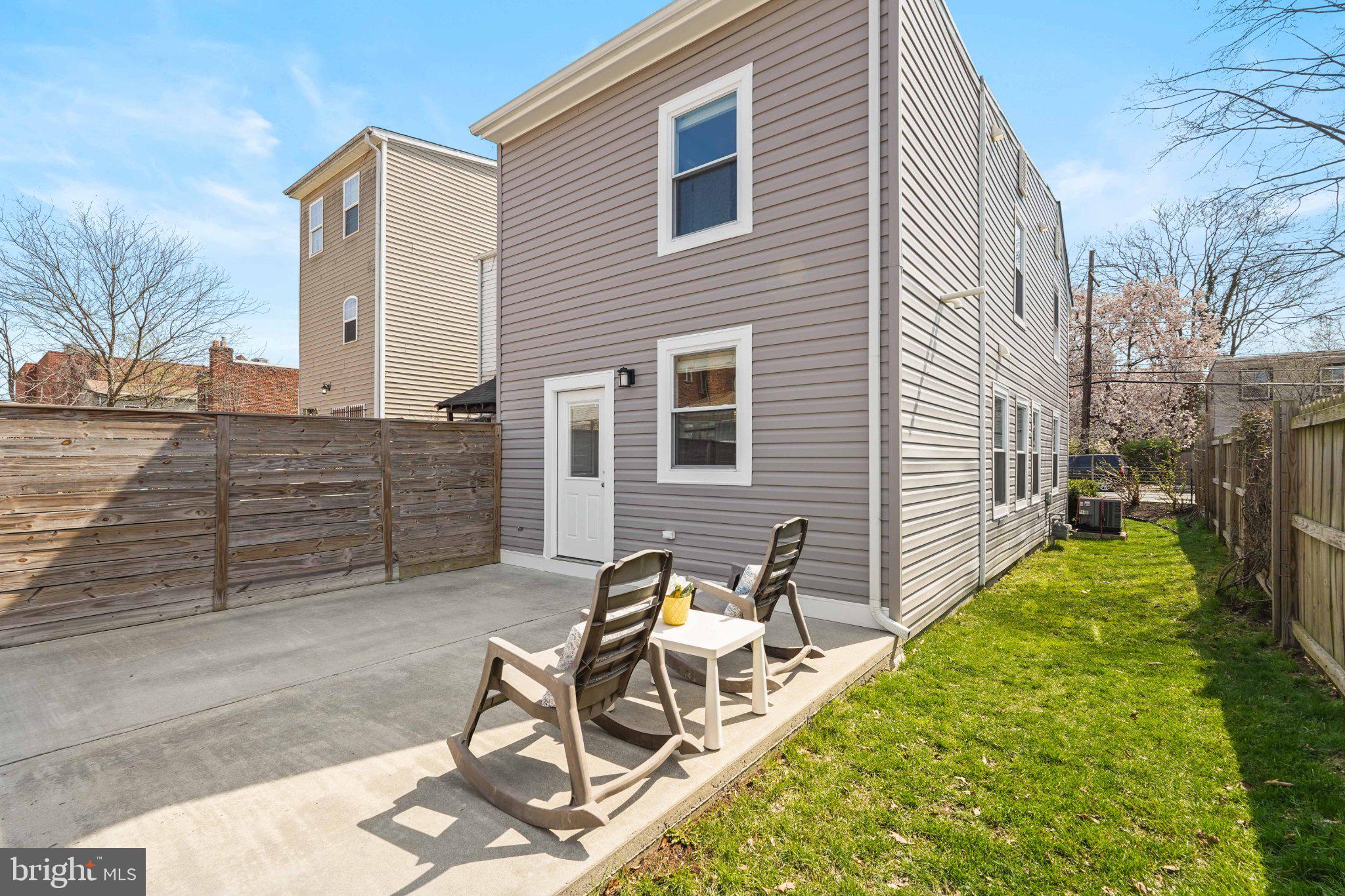 4416 Gault Place Northeast Washington, DC 20019 - Photo 29 of 30 a view of a house with backyard and sitting area