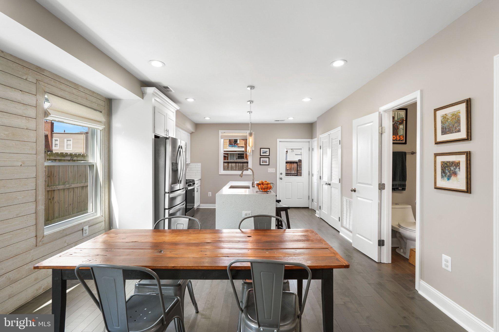 4416 Gault Place Northeast Washington, DC 20019 - Photo 9 of 30 a view of a dining room with furniture and wooden floor