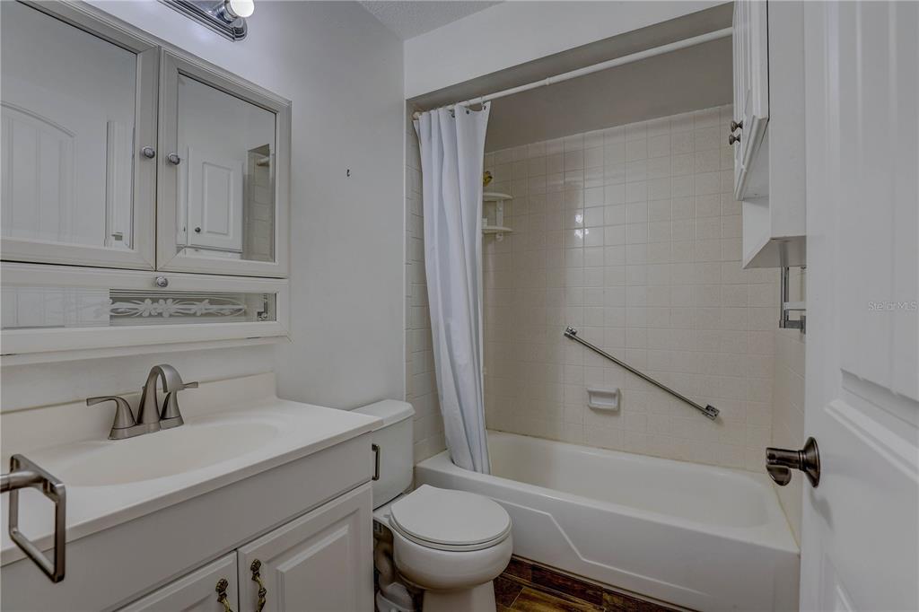 864 Lake Haven Road Dunedin, FL 34698 - Photo 14 of 28 a bathroom with a sink toilet and shower