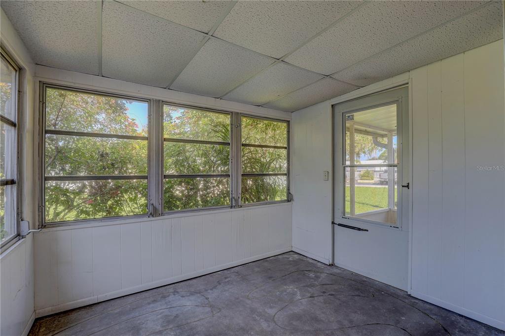 864 Lake Haven Road Dunedin, FL 34698 - Photo 16 of 28 an empty room with windows