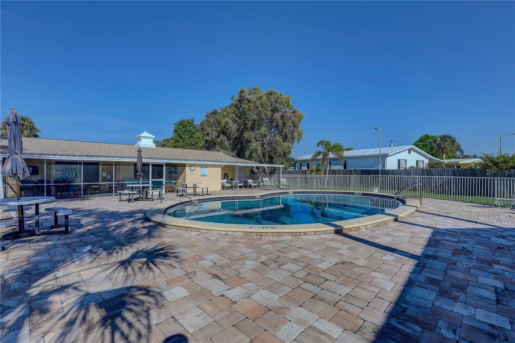 864 Lake Haven Road Dunedin, FL 34698 - Photo 21 of 28 a view of a house with swimming pool