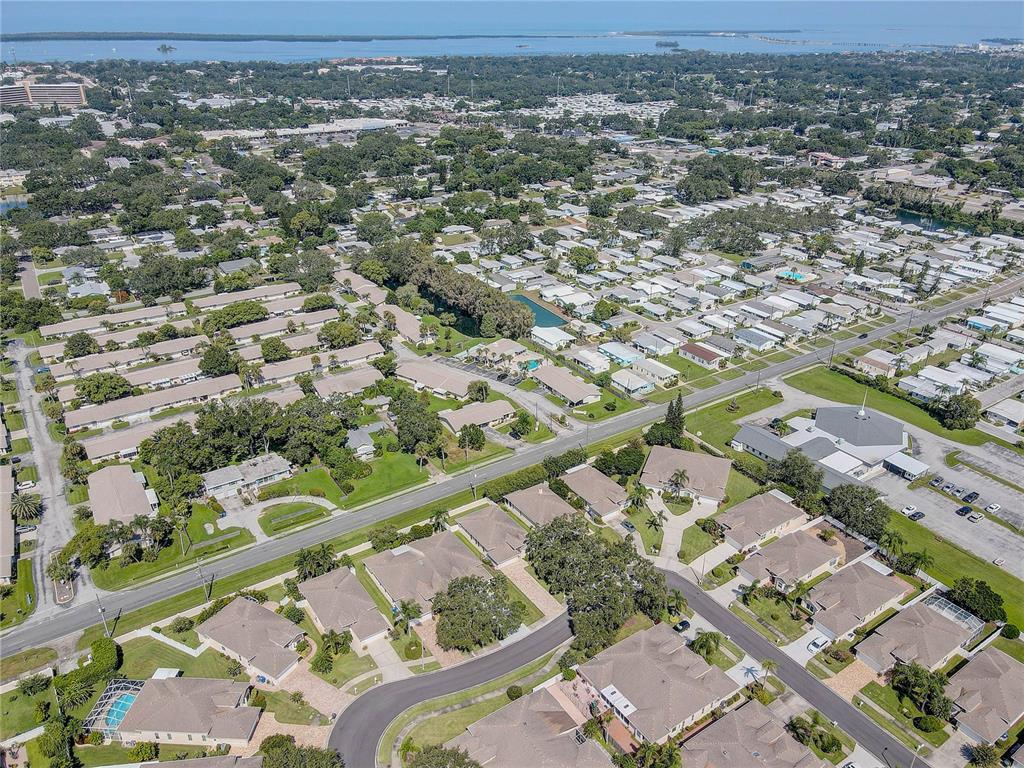 864 Lake Haven Road Dunedin, FL 34698 - Photo 26 of 28 an aerial view of residential houses with outdoor space