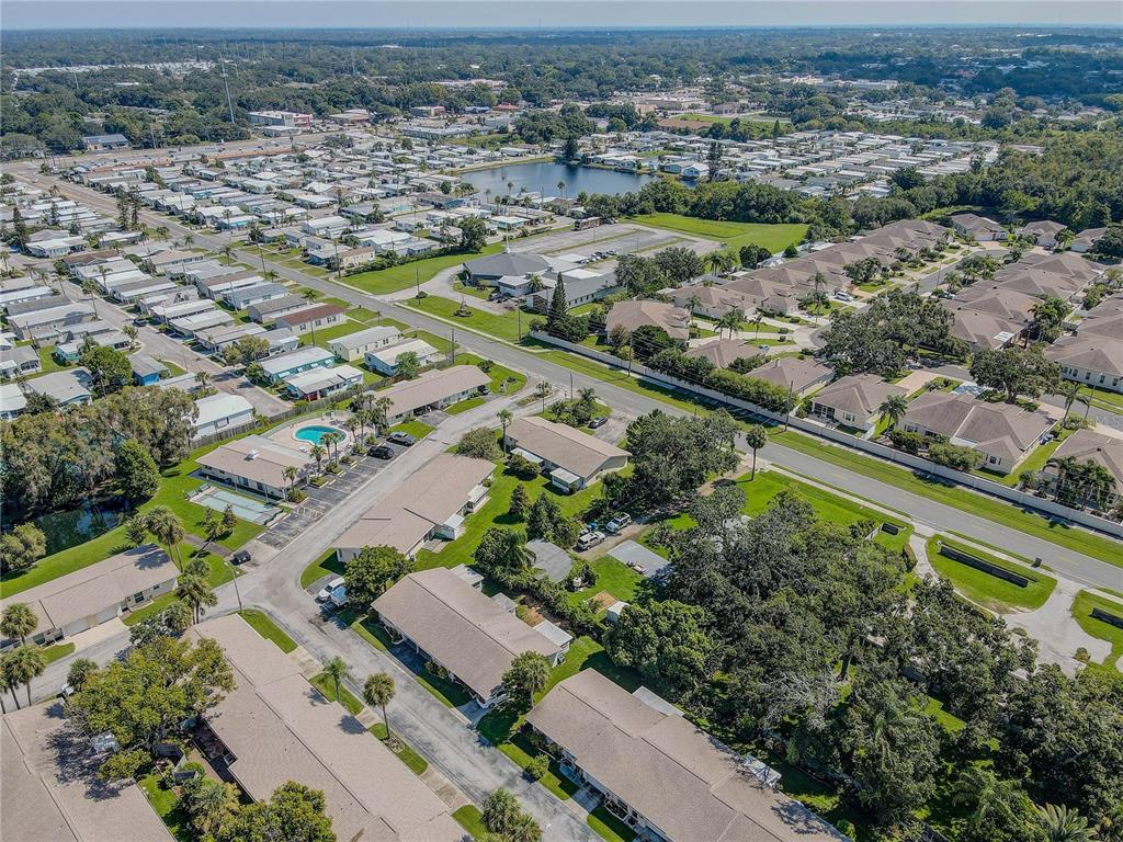 864 Lake Haven Road Dunedin, FL 34698 - Photo 27 of 28 an aerial view of residential houses with outdoor space