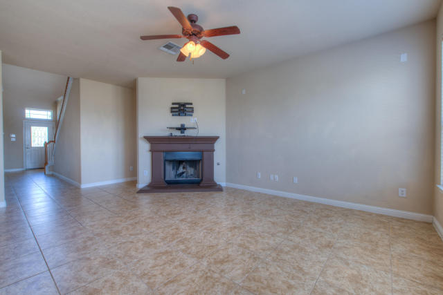 321 Limestone Trail Austin, TX 78737 - Photo 15 of 28 a view of an empty room with a fireplace and a window