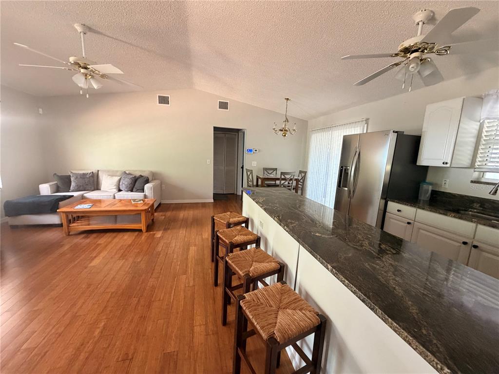 24521 Alligator Road Astor, FL 32102 - Photo 37 of 51 a living room with furniture and wooden floor