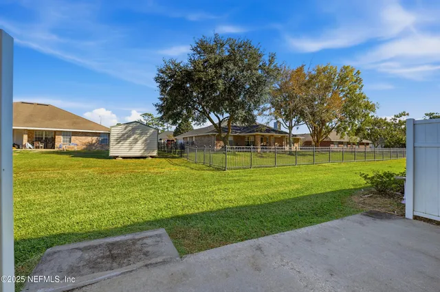 a view of a house with a big yard