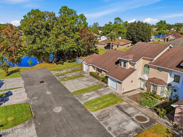an aerial view of a house with a garden