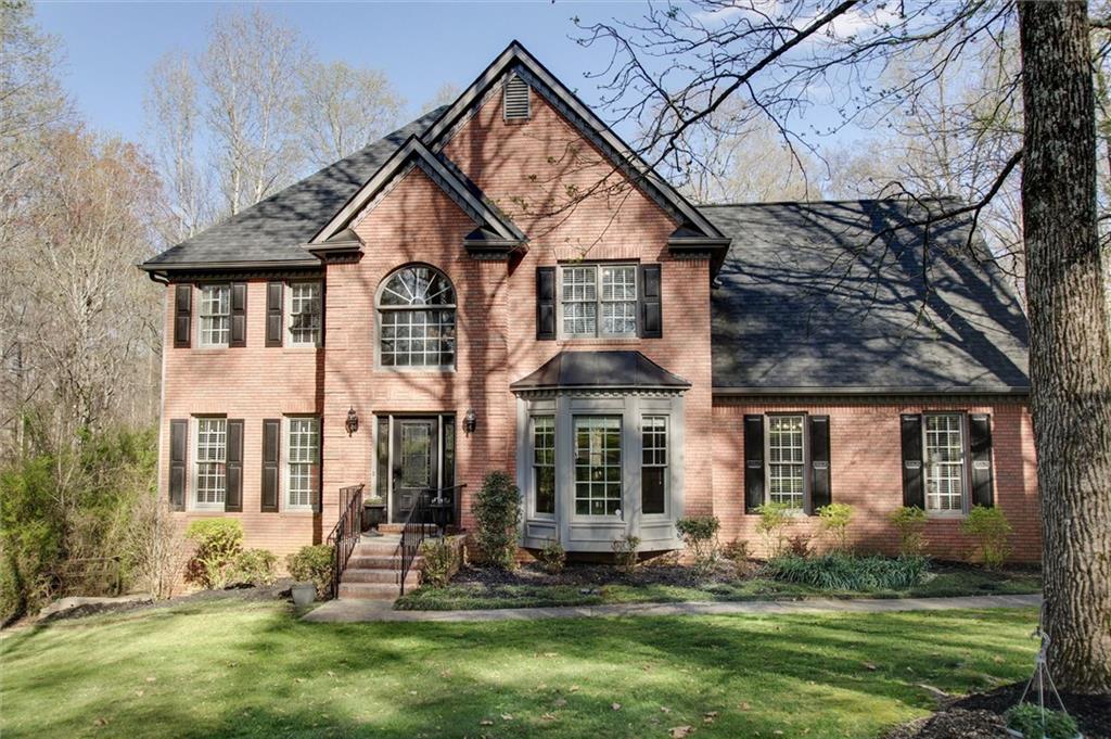 3810 Sugar Pike Road Canton, GA 30115 - Photo 1 of 1 a front view of a house with a yard