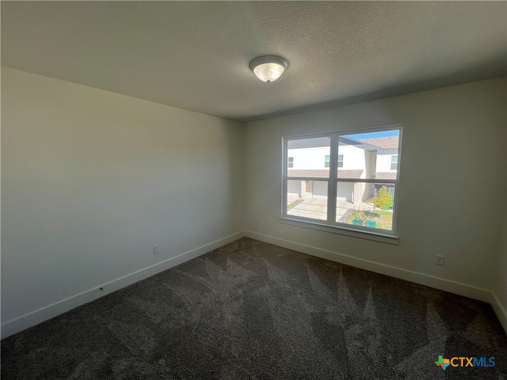 1826 Royal Loop Belton, TX 76513 - Photo 12 of 18 an empty room with a window