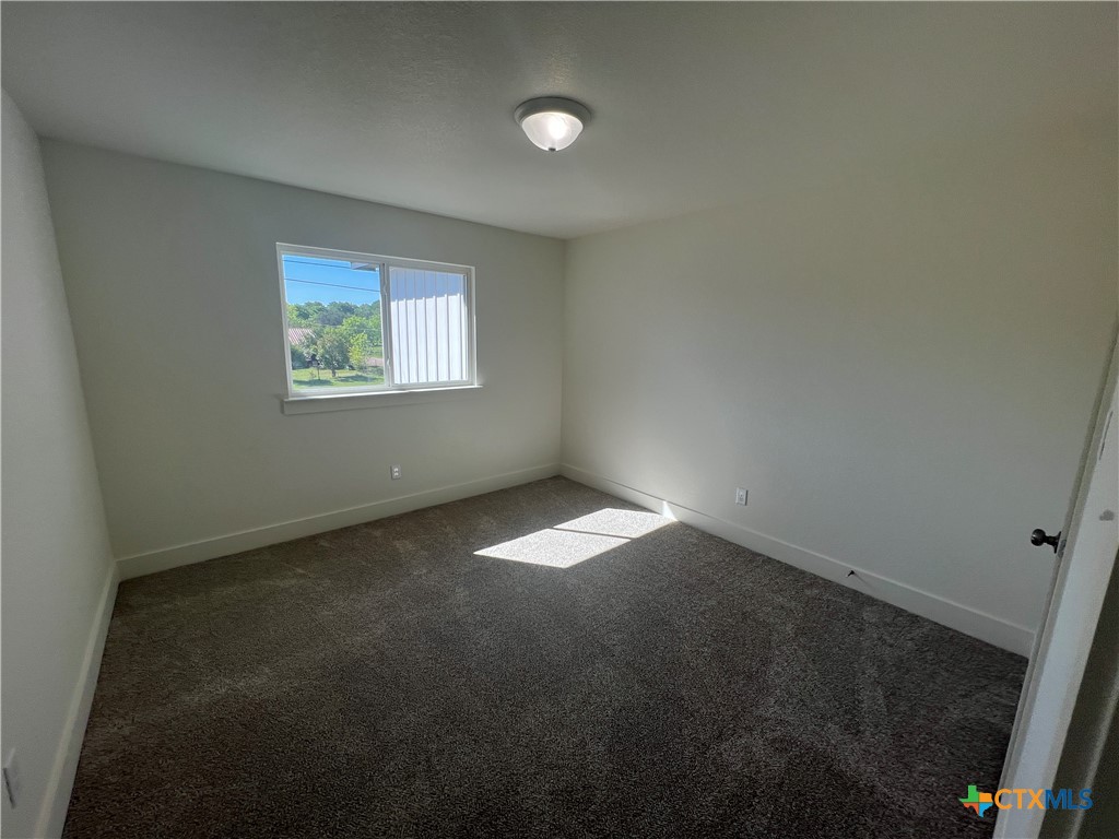 1826 Royal Loop Belton, TX 76513 - Photo 17 of 18 an empty room with a empty space and a window