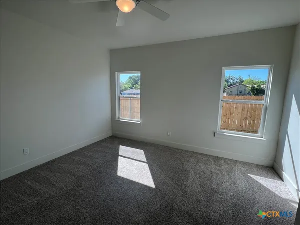 an empty room with windows