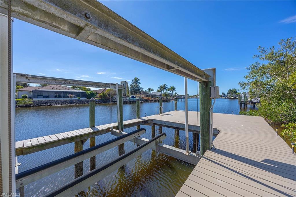 146 Windward Cay Naples, FL 34114 - Photo 28 of 33 a balcony with wooden floor