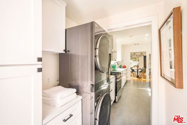 a kitchen with stainless steel appliances a stove a sink and a refrigerator