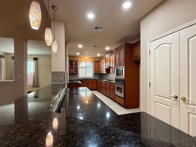 a view of a lobby with black carpet