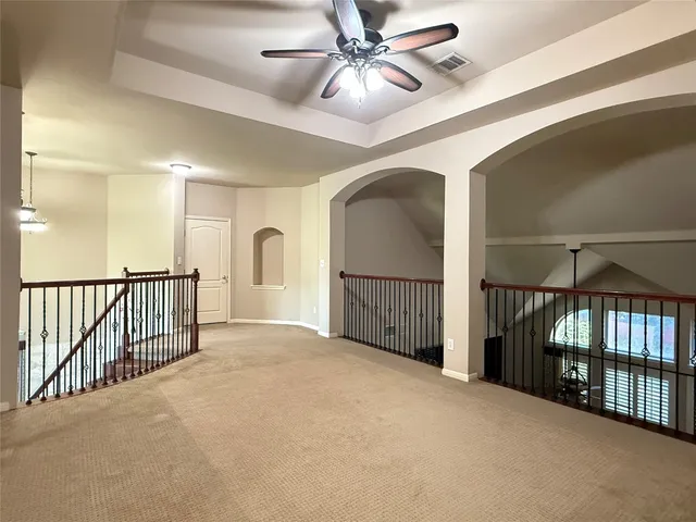 a view of a hallway with a chandelier