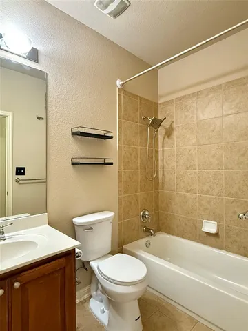 a bathroom with a sink a toilet and a bathtub