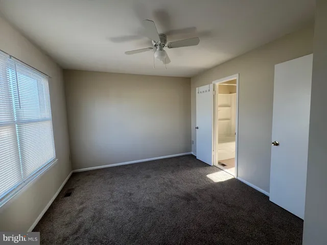 an empty room with a empty space and windows