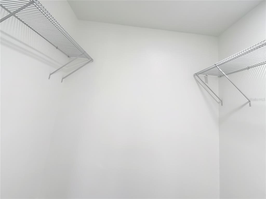 8130 San Felipe Court Port Richey, FL 34668 - Photo 26 of 54 a view of small space with racks on the wall