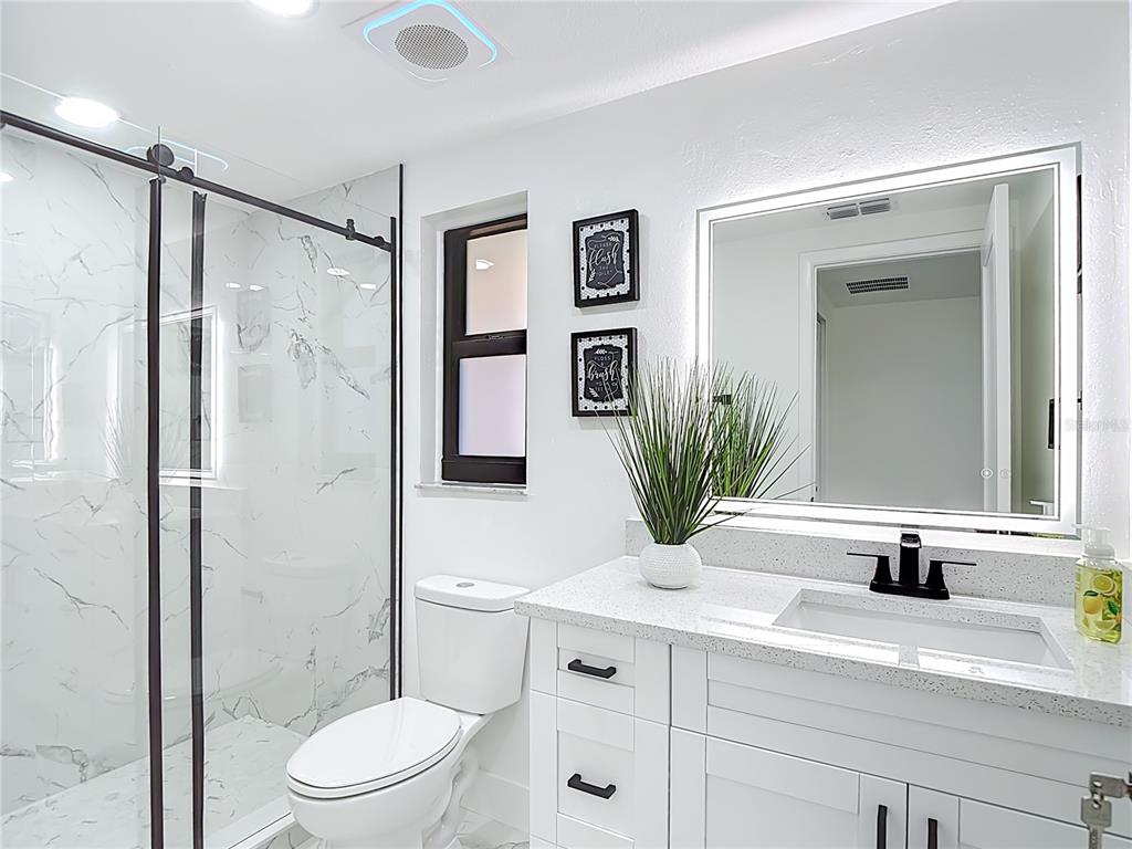 8130 San Felipe Court Port Richey, FL 34668 - Photo 27 of 54 a bathroom with a sink a toilet and shower