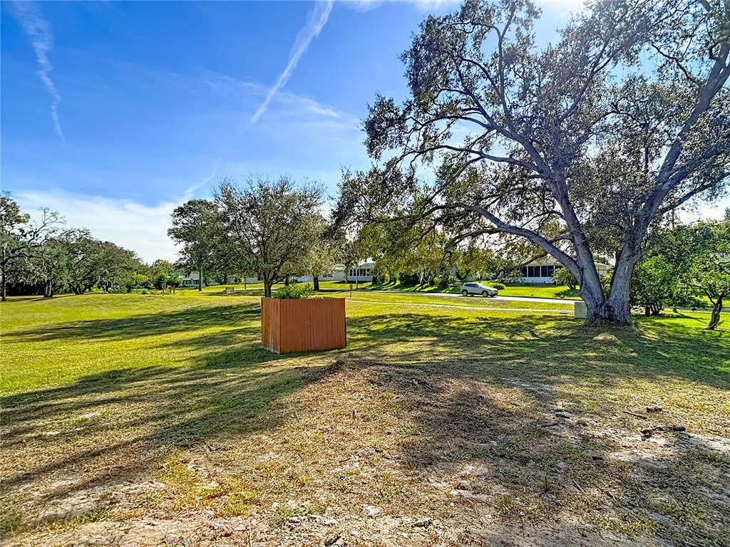 8130 San Felipe Court Port Richey, FL 34668 - Photo 45 of 54 a view of a swimming pool with an outdoor space and seating area