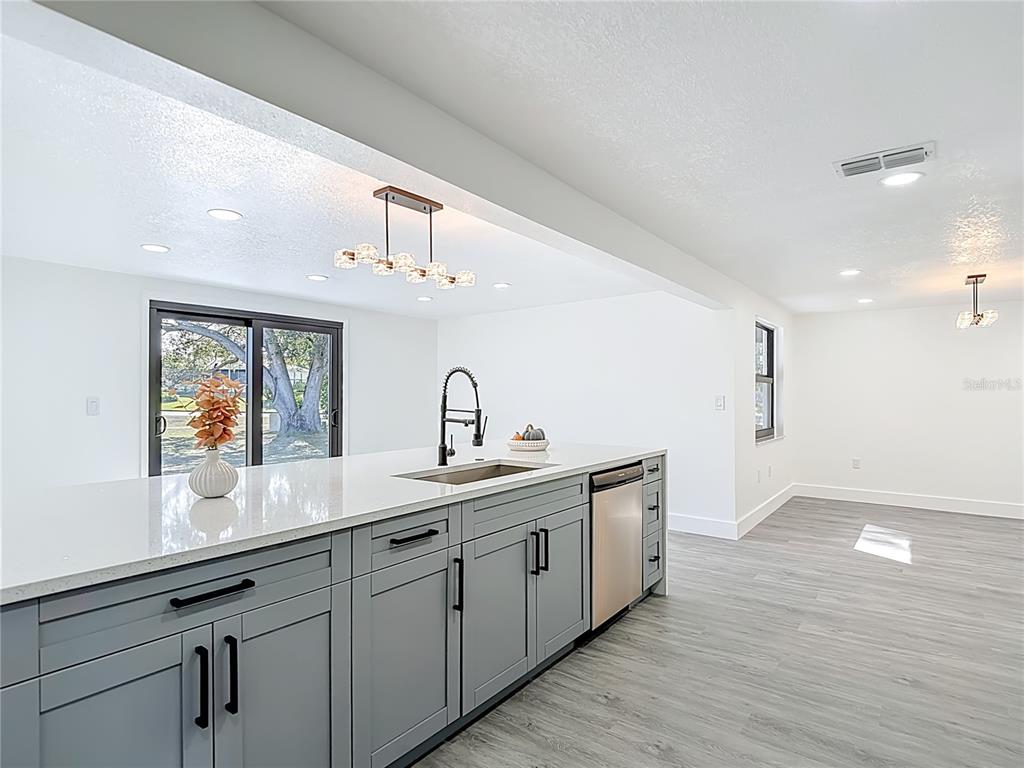 8130 San Felipe Court Port Richey, FL 34668 - Photo 7 of 54 a spacious bathroom with a double vanity sink and a mirror