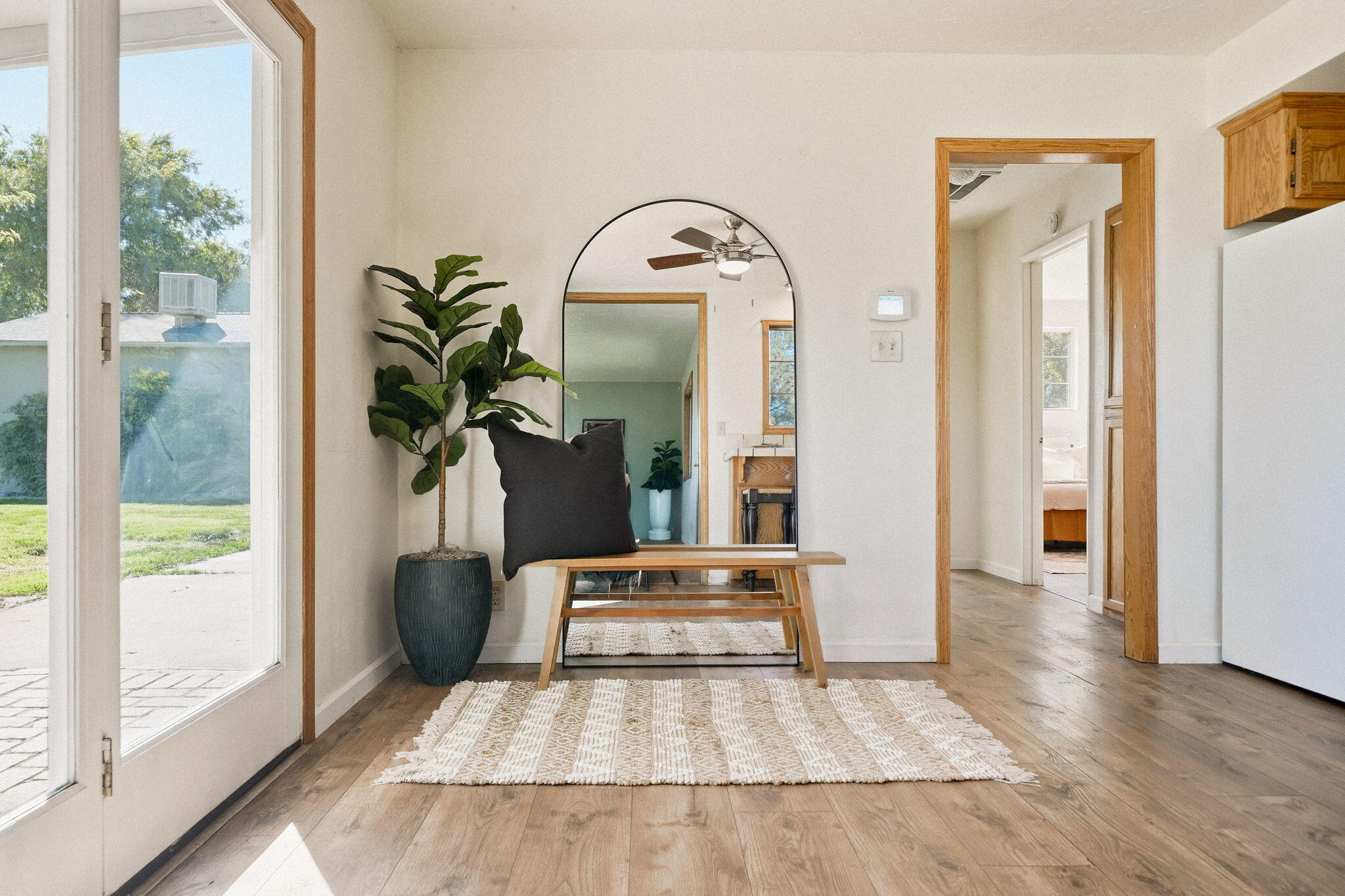 5941 Oak Street Anderson, CA 96007 - Photo 5 of 14 a living room with a bed and a potted plant next to a window