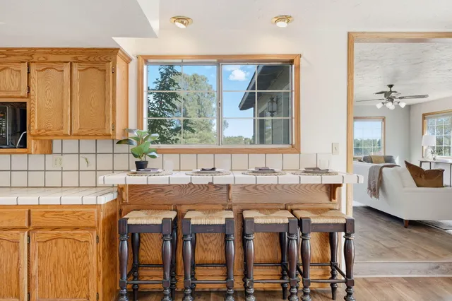 a view of a dining room with furniture and window