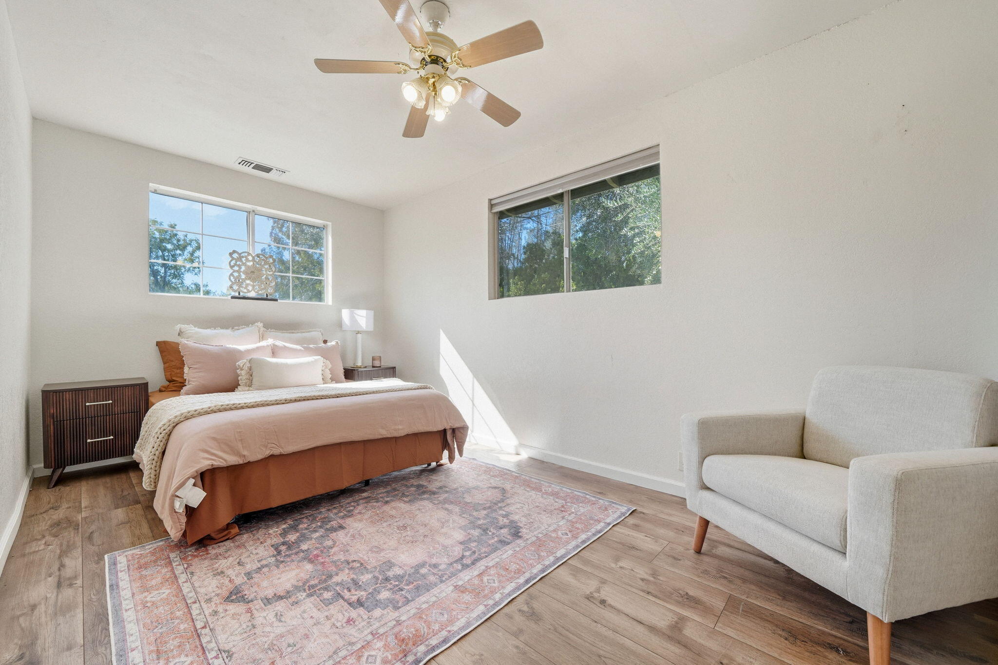 5941 Oak Street Anderson, CA 96007 - Photo 9 of 14 a spacious bedroom with a bed couch and a window