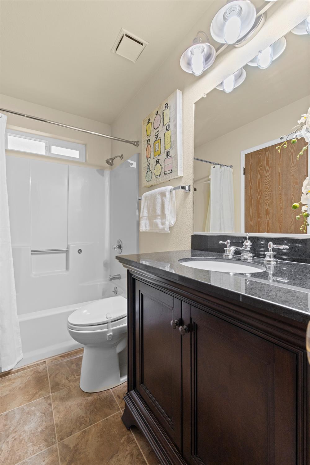6139 Green Ridge Drive Foresthill, CA 95631 - Photo 19 of 30 a bathroom with a sink a toilet and a mirror