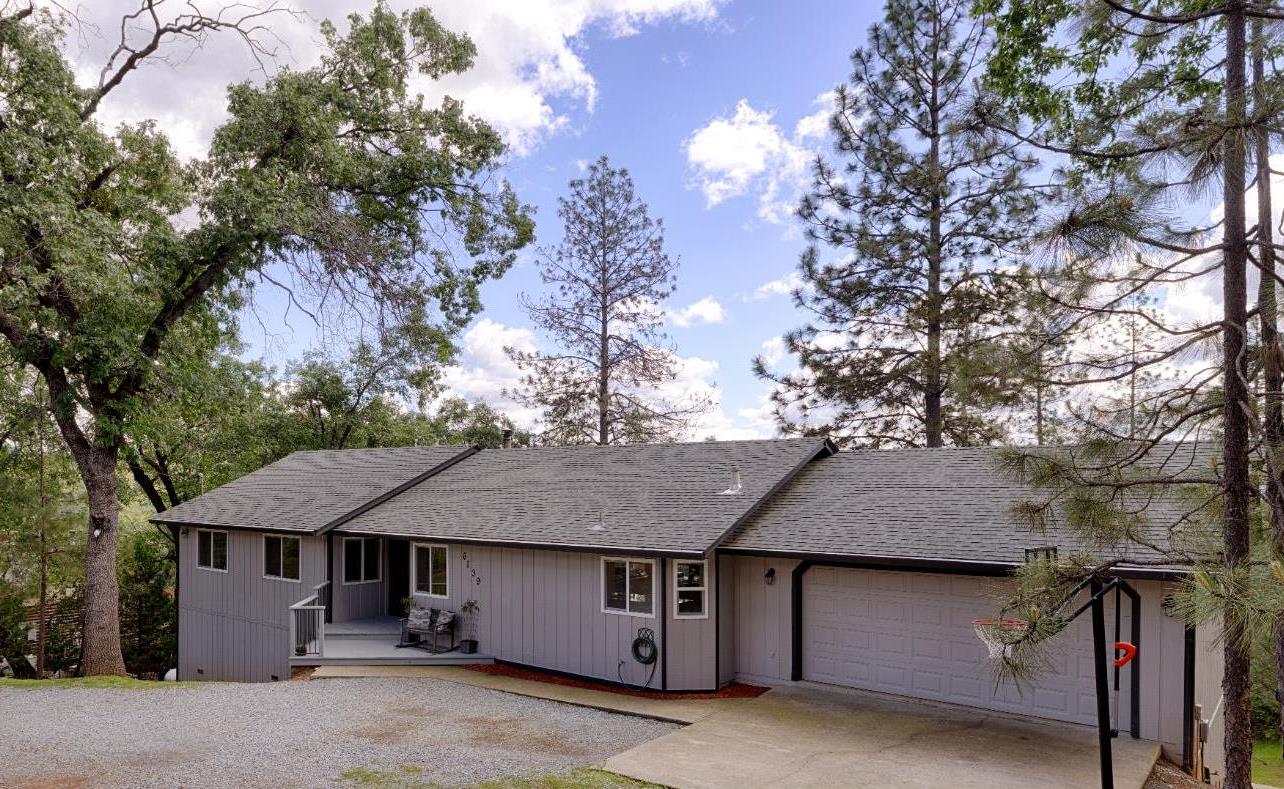6139 Green Ridge Drive Foresthill, CA 95631 - Photo 2 of 30 a view of a barn with large trees plants and large tree