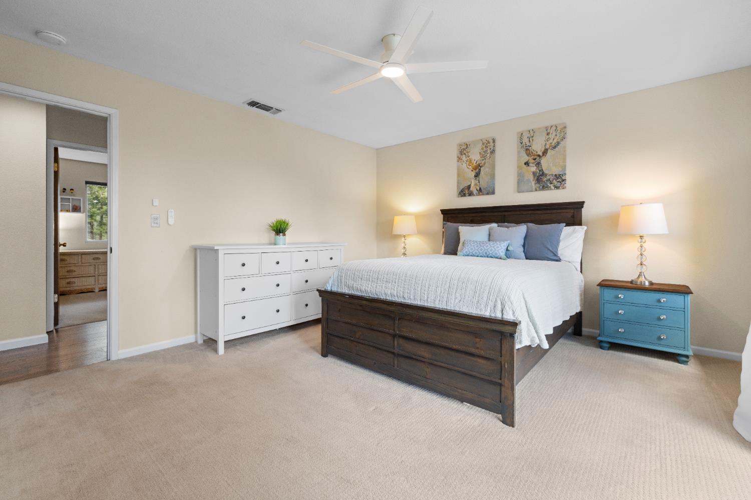 6139 Green Ridge Drive Foresthill, CA 95631 - Photo 21 of 30 a bedroom with furniture and a lamp